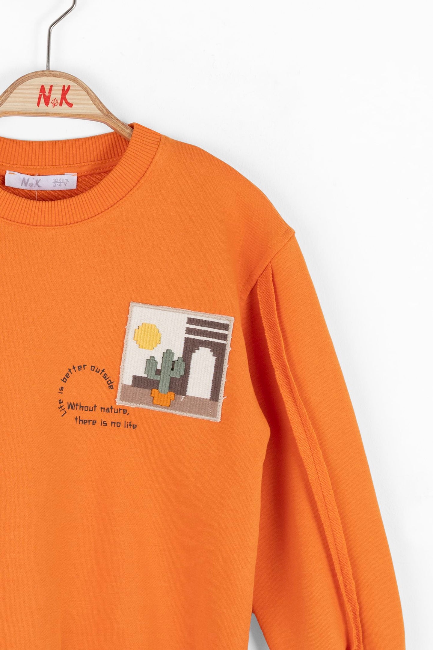 Boys and girls orange sweatshirt. The crew design and soft cotton fabric ensure a comfortable fit.