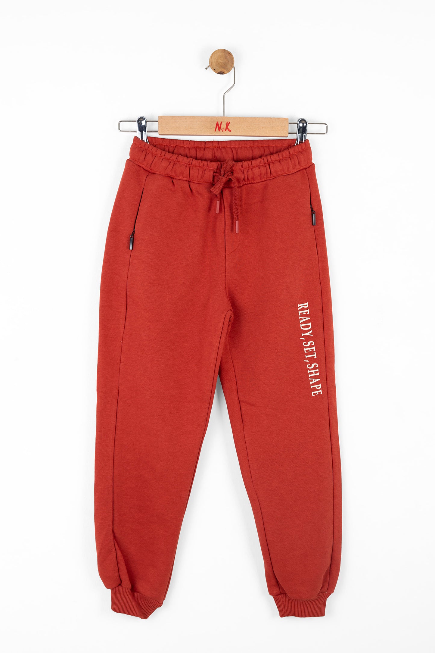 Boys red jogger. Cozy & Stylish for everyday wear.Complete with side pockets and an elastic waistband.